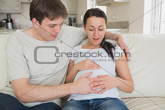 Baby kicking in mother's stomach