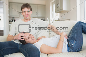 Prospective parents lying on the couch