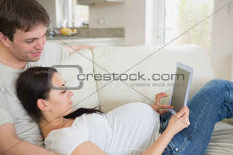 Prospective parents relaxing while using the ebook