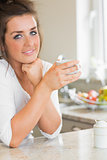 Smiling woman having coffee