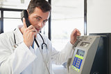 Doctor phoning in the hospital