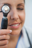 Nurse using otoscope