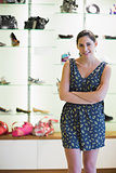Woman standing in front of shoe display