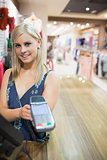 Woman showing credit card machine