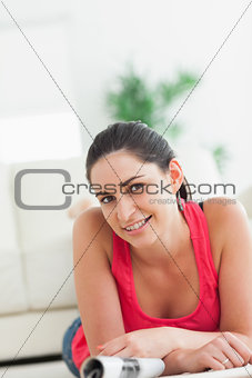 Woman lying on the floor smiling