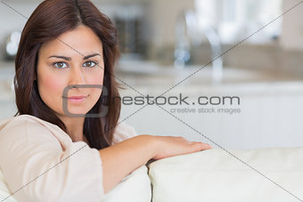 Woman sitting on the couch in the living room