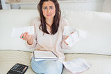 Woman getting stressed over bills