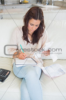 Woman calculating receipts
