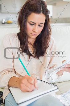 Young woman calculating finances