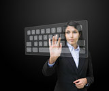 Woman typing on digital keyboard