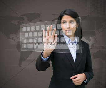Businesswoman typing on projected digital keyboard