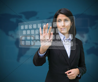 Woman touching digital keyboard against blue background