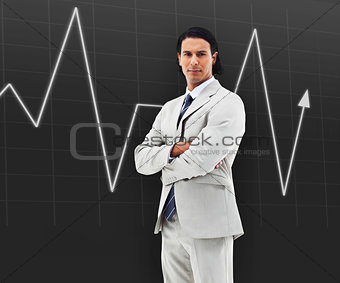 Man with arms crossed standing in front of a statistic