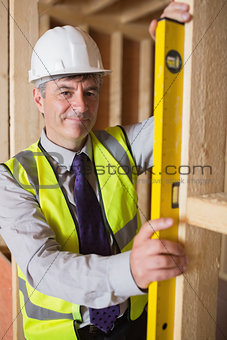 Man checking wooden frame
