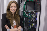 Girl standing in front of rack mounted servers