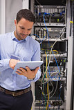 Man in data centre with tablet pc