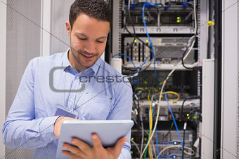Data centre worker with tablet computer