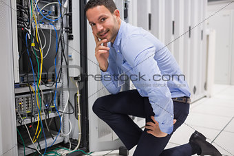 Smiling man checking the servers