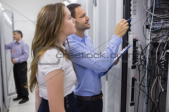 Technicians doing maintenance on servers