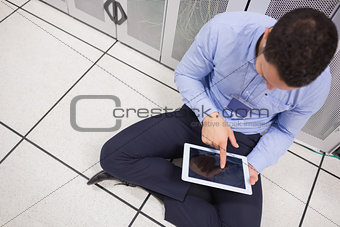 Man with tablet pc in data center