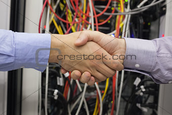 Hand shake in front of wires