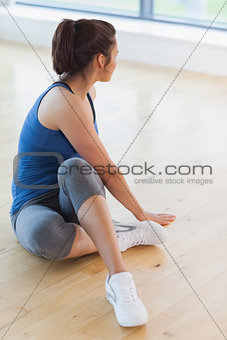 Woman stretching on floor