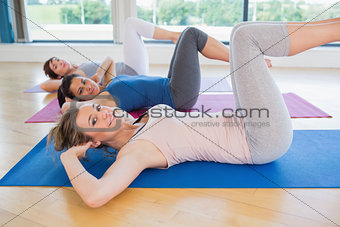Happy women doing core exercise