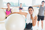 People holding exercise balls