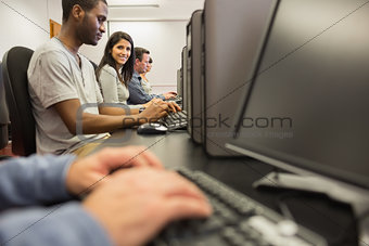 Woman looking up from computer class