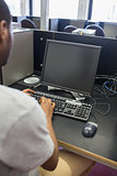 Man typing on computer