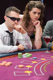 Man and woman at poker table