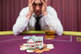Man is betting his house at poker game