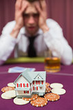 Man risking his house at poker game