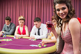 Woman smiling at poker table