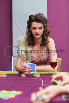 Woman sitting holding cards