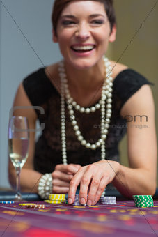 Woman laughing at table
