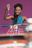 Woman sitting at a roulette table