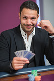 Man holding his cards