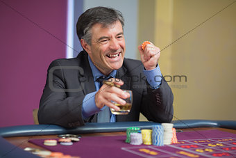 Man winning at roulette table