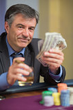 Man holding money and smiling