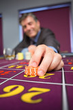 Man placing roulette bet