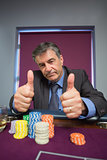 Man giving thumbs up at roulette table