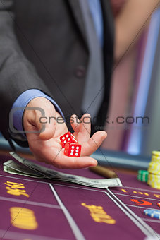 Man holding dice