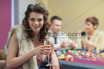 Woman with champagne smiling