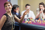 Happy woman at roulette table