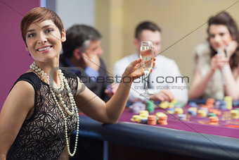 Happy woman at roulette table