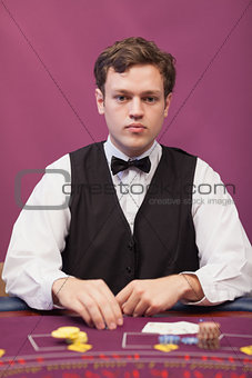 Dealer at table of a casino