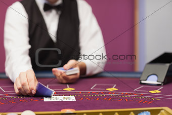 Dealer dealing cards in a casino
