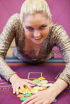 Smiling woman taking chips