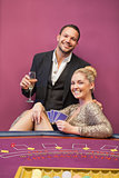 Happy couple at poker table